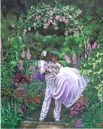 A man in white carries a woman in a garden full of flowers.