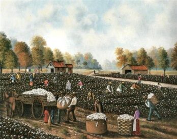 Workers harvesting cotton in a rural field with houses and trees in the background.