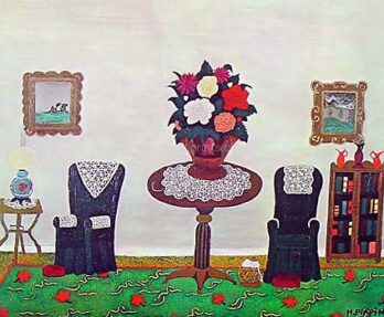 A whimsical room with flower-shaped chairs and a vase of colorful flowers on a round table.