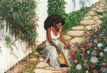 A woman in a white dress tending to a garden by stone steps.