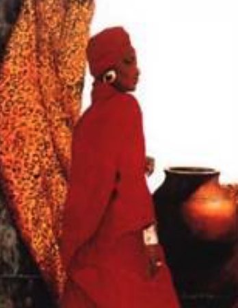 A woman in traditional red attire stands near large clay pots.